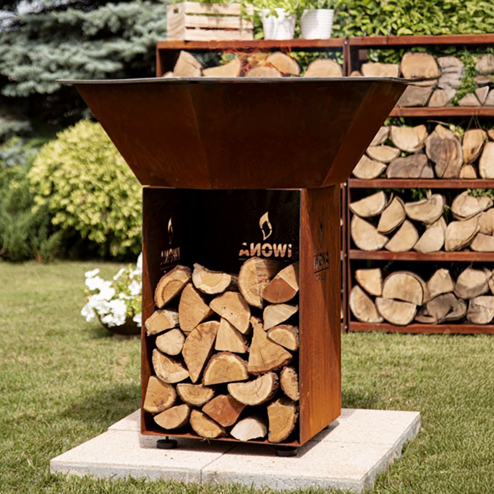 Le brasero plancha Iwona Grill 100 est équipé d'un espace pour stocker le bois