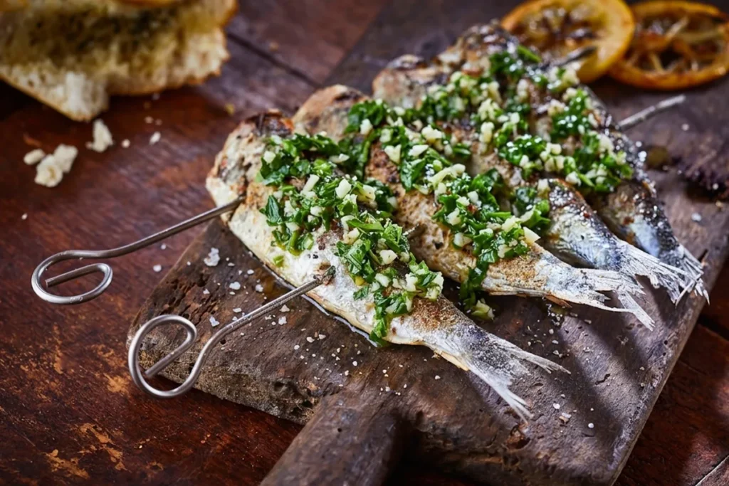 Recette de sardines grillées au brasero plancha avec persillade et citrons confits